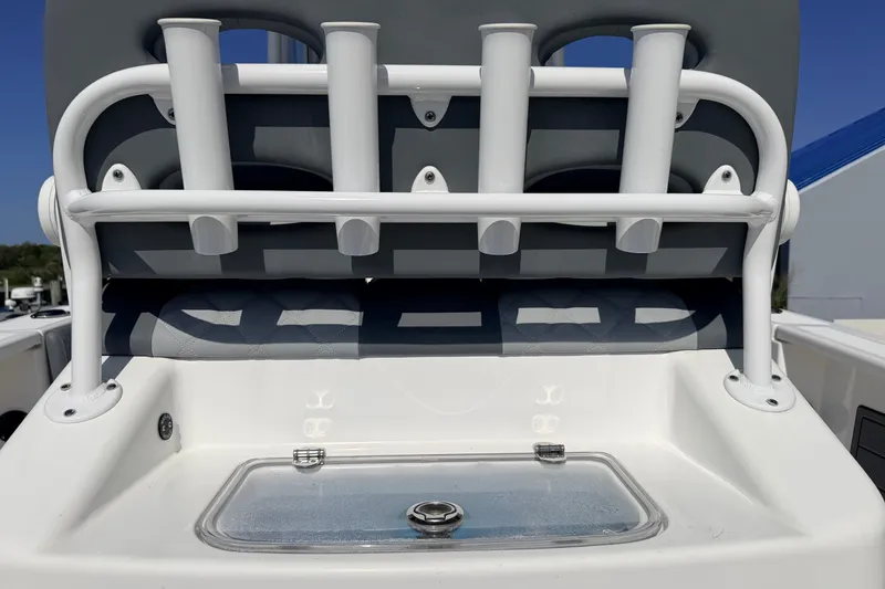Slide: The Image of 2025 NauticStar 251 Hybrid boat with rod holders and storage compartment. - 14