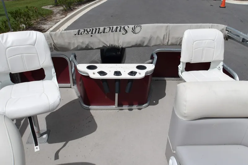 Slide: The Image of 2010 Lowe SF 194 Sport Fish boat interior with white seating and fishing rod holders. - 5