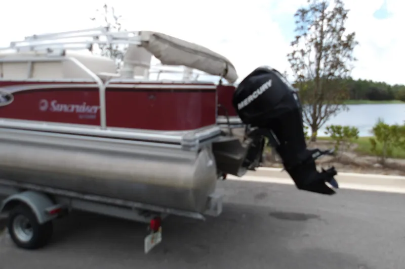 Slide: The Image of 2010 Lowe SF 194 Sport Fish boat on trailer with Mercury outboard motor. - 9
