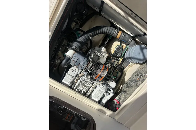 Slide: The Image of Engine compartment of a 2009 Ranger Tugs R-25 boat, showcasing mechanical components. - 35