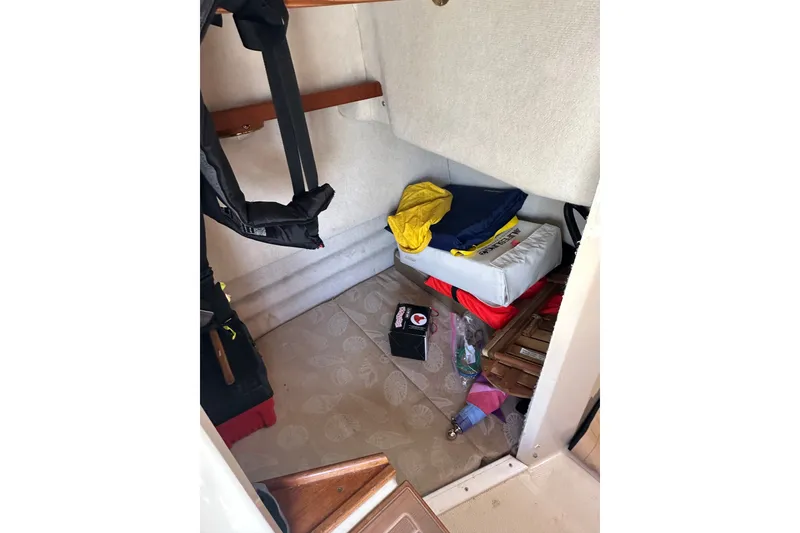Slide: The Image of Interior cabin of 2009 Ranger Tugs R-25 with storage and life jackets. - 17