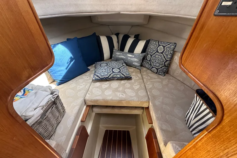 Slide: The Image of Cozy cabin interior of 2009 Ranger Tugs R-25 with patterned cushions and pillows. - 27