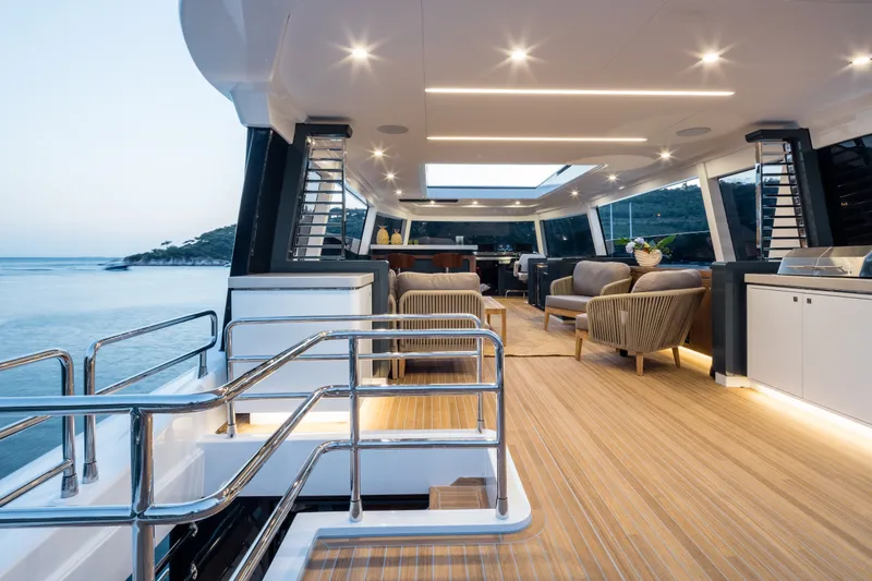 Slide: The Image of Luxurious interior of 2027 Sirena 78 yacht with modern seating and ocean view. - 16