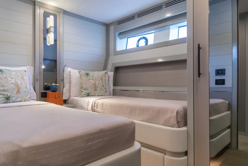 Slide: The Image of Luxurious twin bedroom in 2027 Sirena 78 yacht, featuring modern decor and elegant bedding. - 41