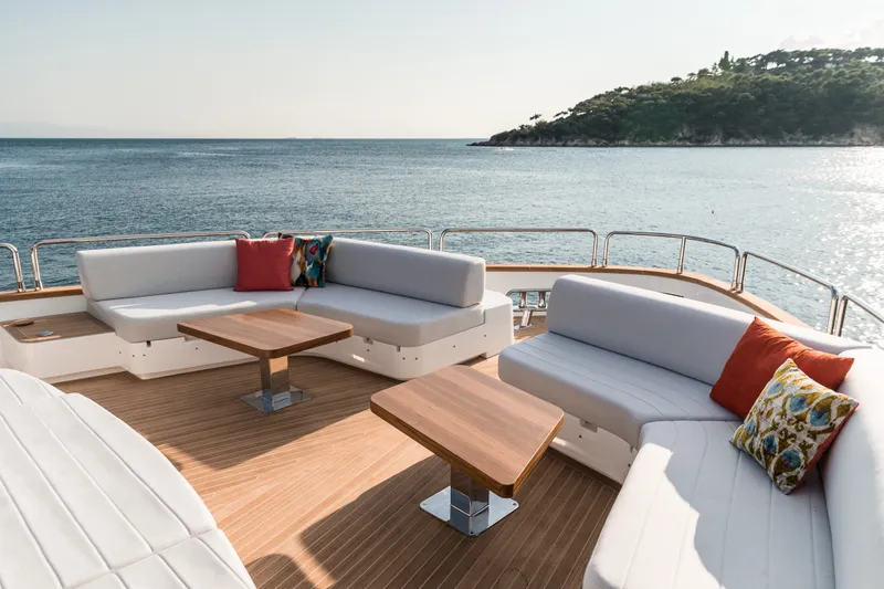Slide: The Image of Luxurious Sirena 78 yacht deck with elegant seating, ocean view, and stylish cushions, 2027 model. - 15