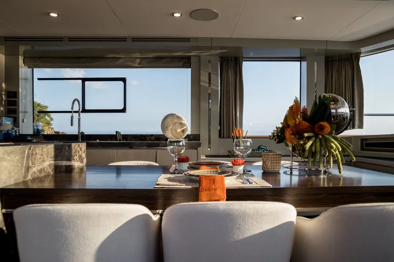 Slide: The Image of Luxurious interior of 2027 Sirena 78 yacht with elegant dining setup and ocean view. - 28