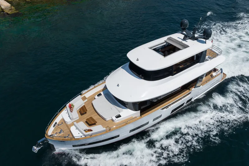 Slide: The Image of Luxurious 2027 Sirena 78 yacht cruising on clear blue waters. - 10