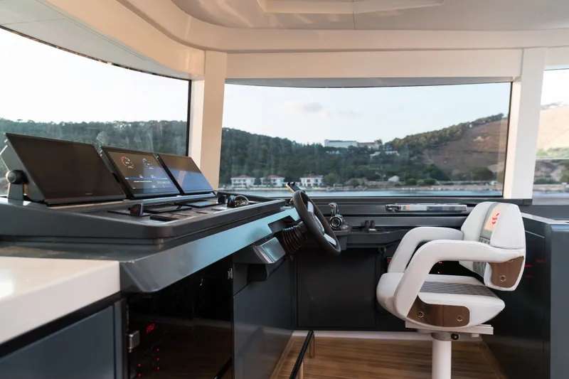 Slide: The Image of Modern helm station of 2027 Sirena 78 yacht with advanced navigation displays. - 21