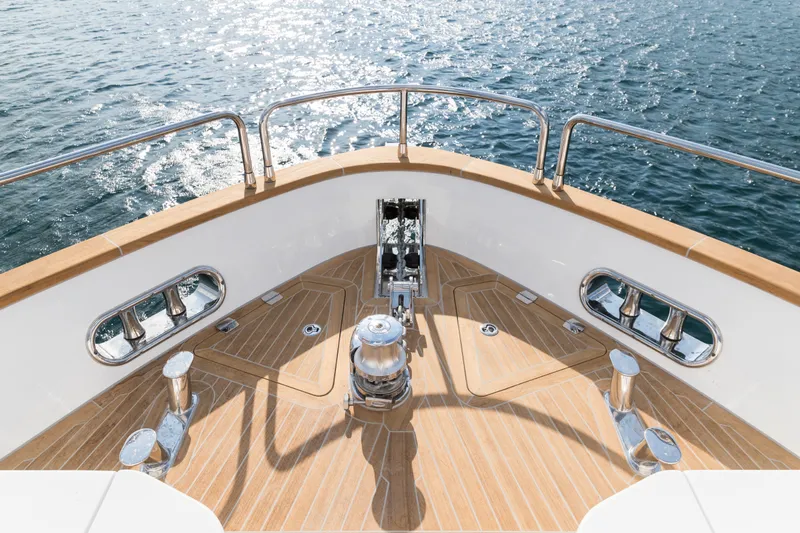 Slide: The Image of Bow of 2027 Sirena 78 yacht with teak deck and ocean view. - 13