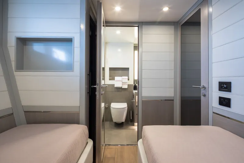 Slide: The Image of Modern Sirena 78 yacht interior with twin beds and ensuite bathroom, 2027 model. - 42