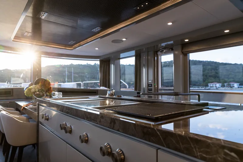 Slide: The Image of Luxurious interior of 2027 Sirena 78 yacht with modern kitchen and scenic views. - 23