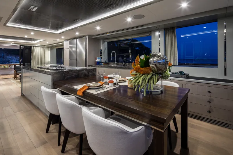 Slide: The Image of Luxurious interior of 2027 Sirena 78 yacht with elegant dining area and modern kitchen. - 27