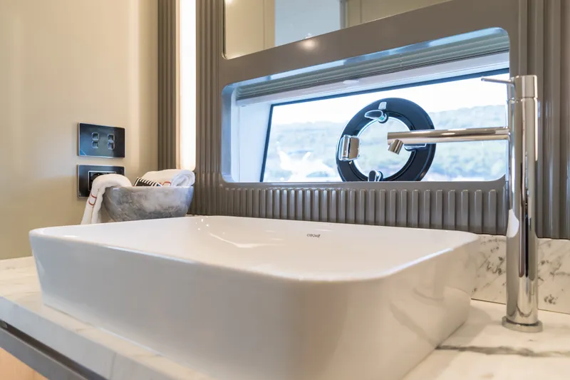 Slide: The Image of Modern bathroom sink with sleek faucet on Sirena 78 yacht, 2027 model. - 32
