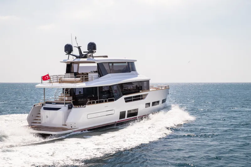 Slide: The Image of Luxurious 2027 Sirena 78 yacht cruising on open sea under clear skies. - 4