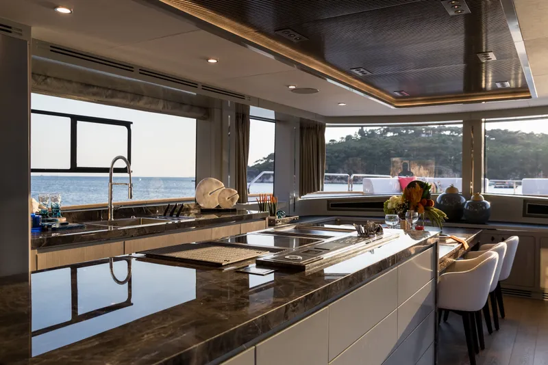 Slide: The Image of Luxurious interior of 2027 Sirena 78 yacht with modern kitchen and ocean view. - 22