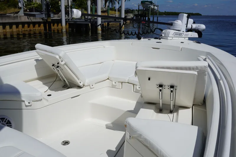 Slide: The Image of 2021 Regulator 24XO boat interior with white seating and open water view. - 30