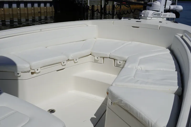 Slide: The Image of 2021 Regulator 24XO boat interior with white cushioned seating. - 29