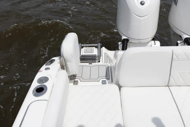 Slide: The Image of Manufacturer Provided Image: 2025 Sea Fox 268 Commander boat interior with white seating and dual engines. - 20