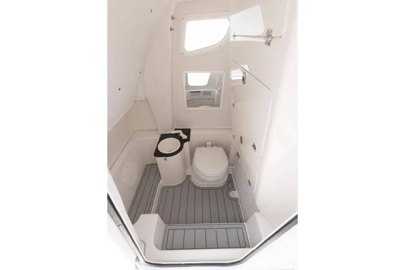 Slide: The Image of Manufacturer Provided Image: 2025 Sea Fox 268 Commander boat interior bathroom with toilet and storage. - 23