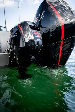 Slide: The Image of Rear view of a boat with two outboard motors in the water. - 15