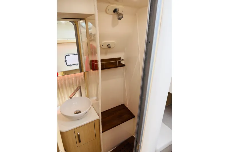 Slide: The Image of 2024 Regal 33 SAV bathroom interior with modern sink and shower. - 14