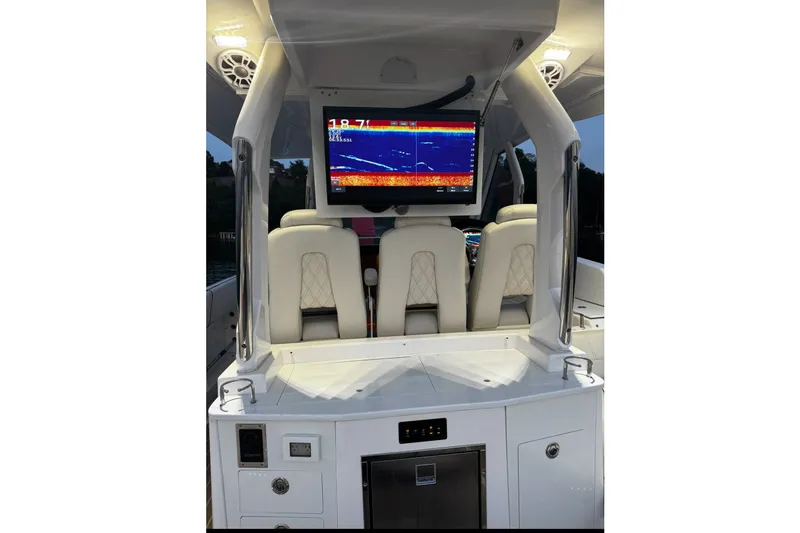 Slide: The Image of 2024 Regal 33 SAV boat interior with navigation screen and luxurious seating. - 4
