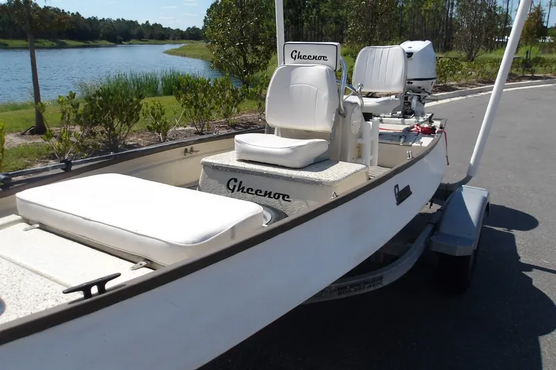 Slide: The Image of 2004 Gheenoe Classic 15 boat on trailer by a scenic lake. - 7