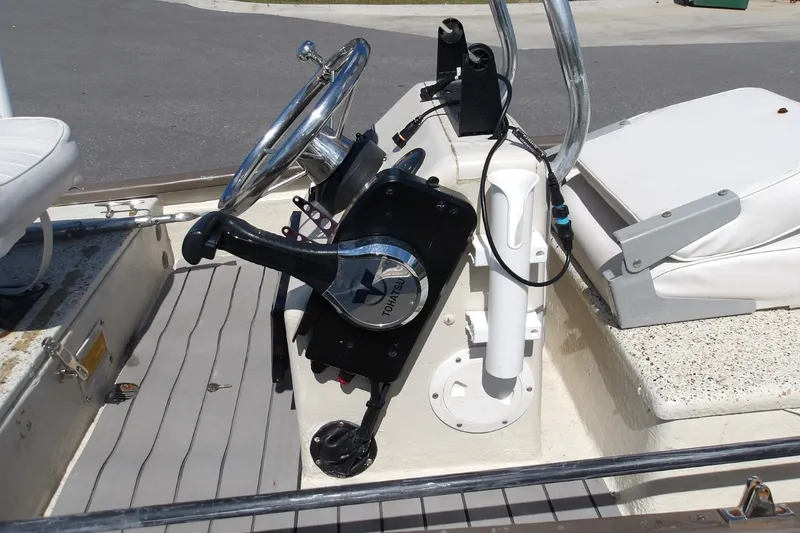 Slide: The Image of 2004 Gheenoe Classic 15 boat interior with steering wheel and controls. - 3