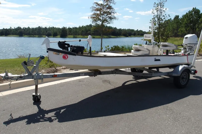Slide: The Image of 2004 Gheenoe Classic 15 boat on trailer by a scenic lake. - 5