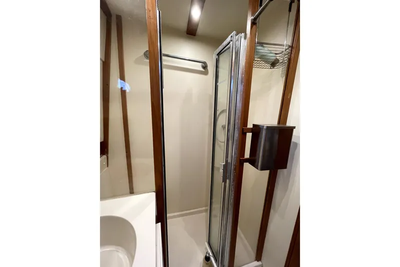 Slide: The Image of Bathroom interior of 2001 Mainship 390 Trawler with shower and sink. - 20