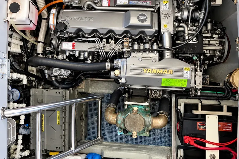 Slide: The Image of Engine room of 2001 Mainship 390 Trawler featuring Yanmar diesel engine components. - 33
