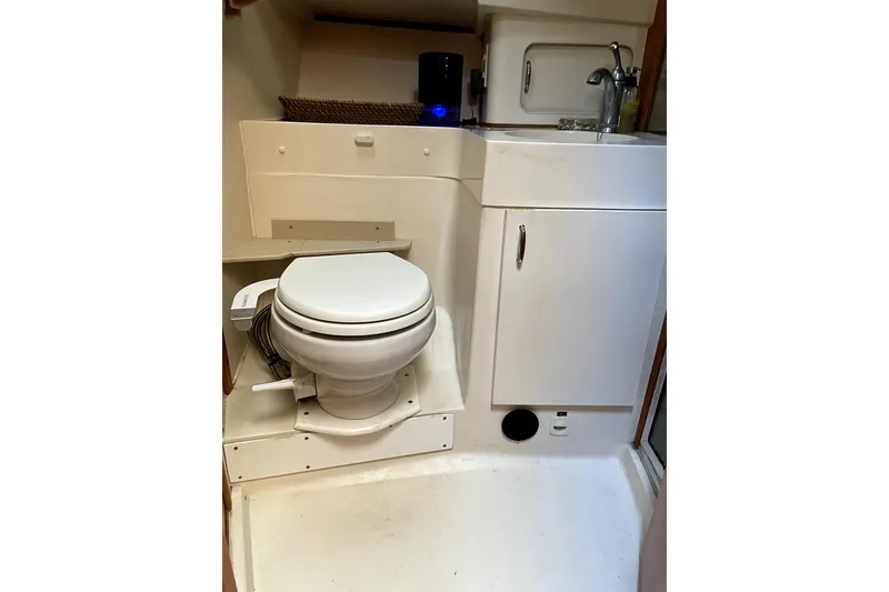 Slide: The Image of 2001 Mainship 390 Trawler bathroom with toilet and sink. - 19