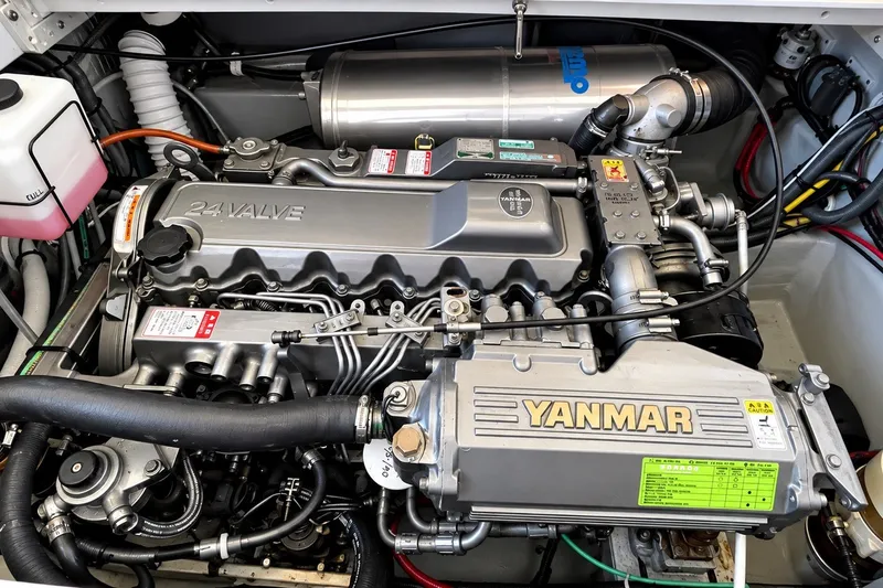 Slide: The Image of Engine compartment of a 2001 Mainship 390 Trawler featuring a Yanmar 24-valve engine. - 34