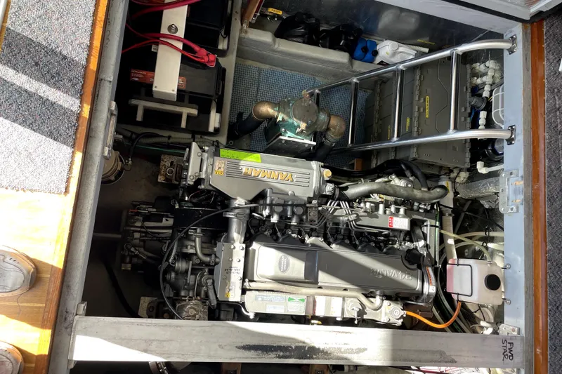 Slide: The Image of Engine compartment of a 2001 Mainship 390 Trawler, featuring a Yanmar engine. - 30