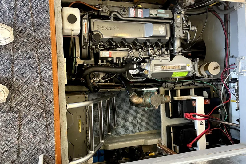 Slide: The Image of Engine room of 2001 Mainship 390 Trawler with Yanmar engine and visible wiring. - 31