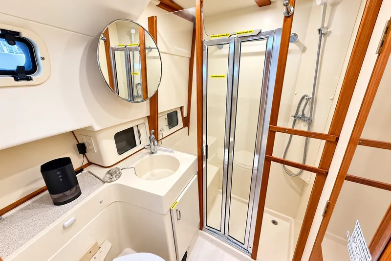 Slide: The Image of Bathroom interior of 2001 Mainship 390 Trawler with shower and vanity. - 25