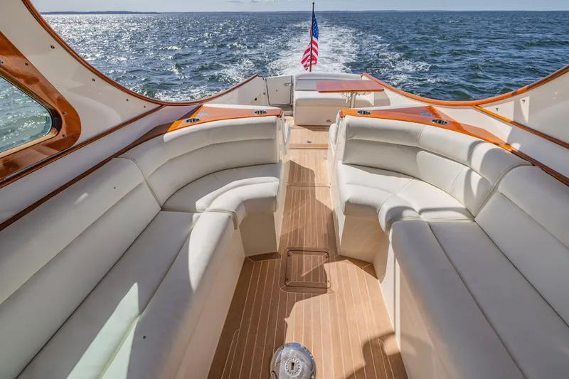 Slide: The Image of 2021 Hinckley Picnic Boat 34 MKII interior with elegant seating and ocean view. - 8