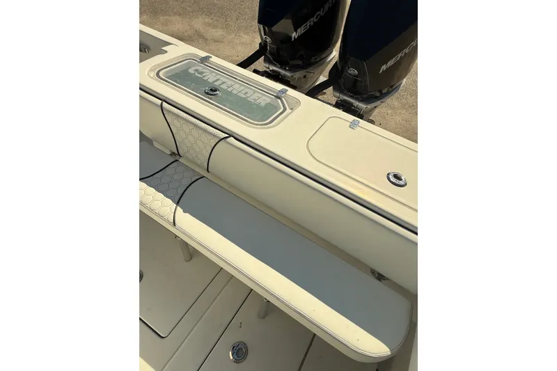 Slide: The Image of 2020 Contender 30 Tournament boat interior with seating and dual Mercury engines. - 14