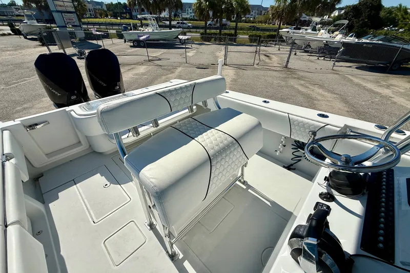 Slide: The Image of 2020 Contender 30 Tournament boat interior with dual engines and steering wheel. - 18