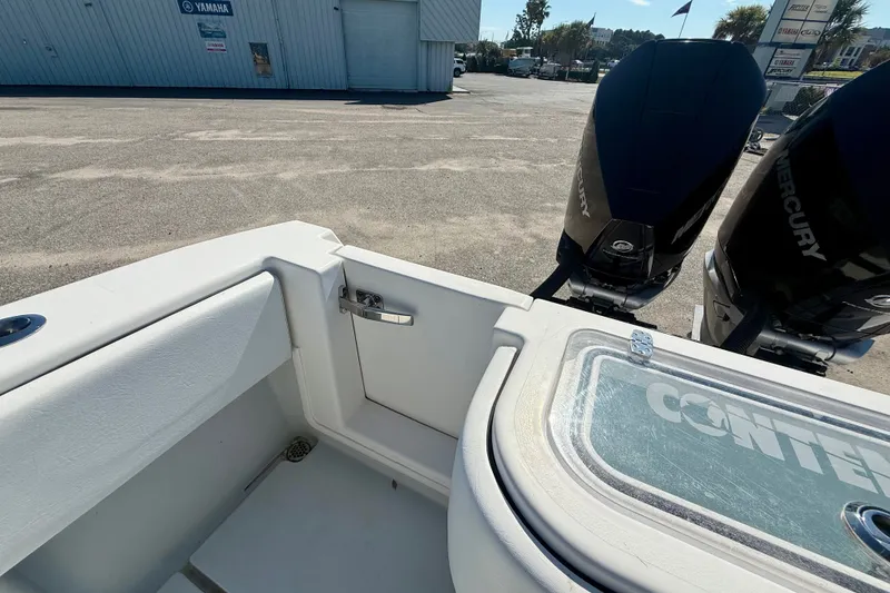Slide: The Image of 2020 Contender 30 Tournament boat with dual Mercury engines at a dealership. - 17