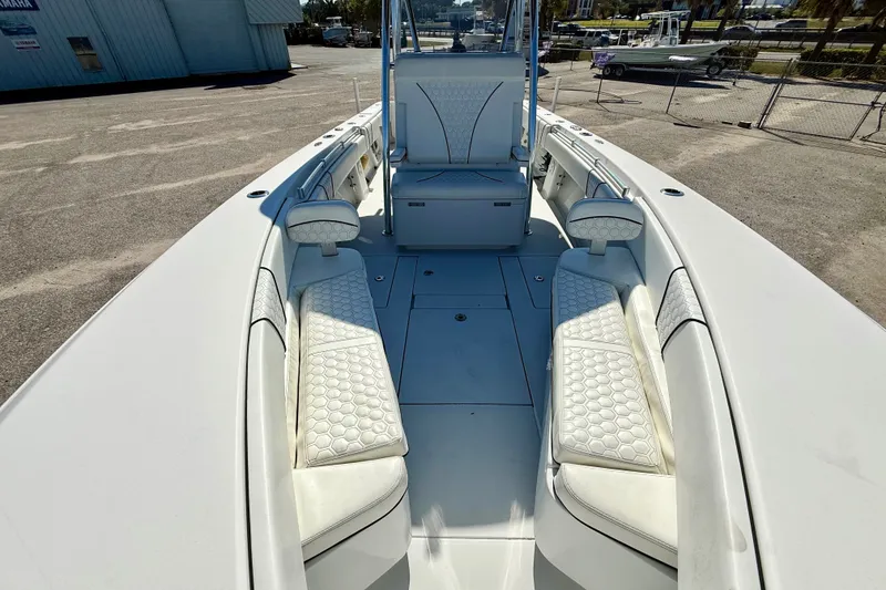 Slide: The Image of 2020 Contender 30 Tournament boat interior with white seating and spacious deck. - 19