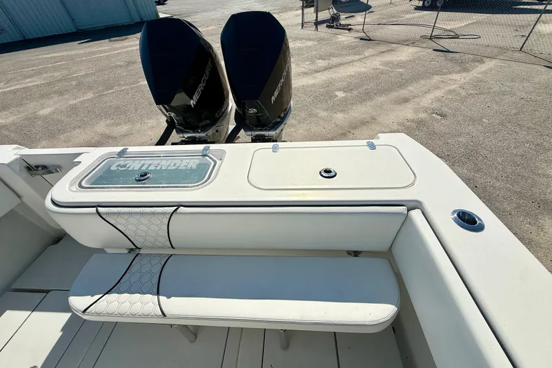 Slide: The Image of 2020 Contender 30 Tournament boat with twin Mercury engines and cushioned seating. - 15