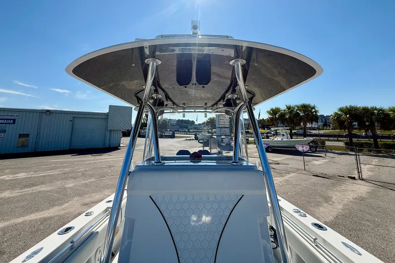 Slide: The Image of 2020 Contender 30 Tournament boat with T-top, parked outdoors under clear sky. - 21