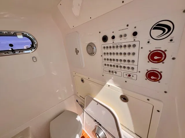 Slide: The Image of Interior view of a boat with a control panel and a small window. - 10