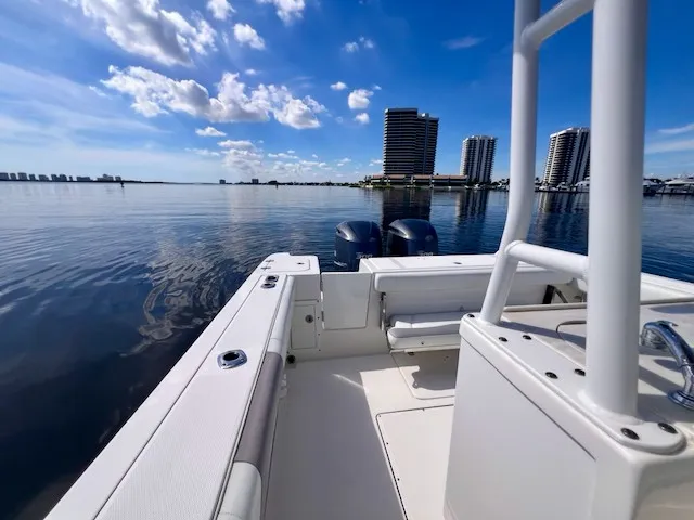 Slide: The Image of Edgewater 320CC 2018 on calm water with high-rise buildings in the background. - 47