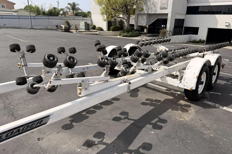 Slide: The Image of Boat trailer for 1985 Tiara 2700 Continental in a parking lot. - 23
