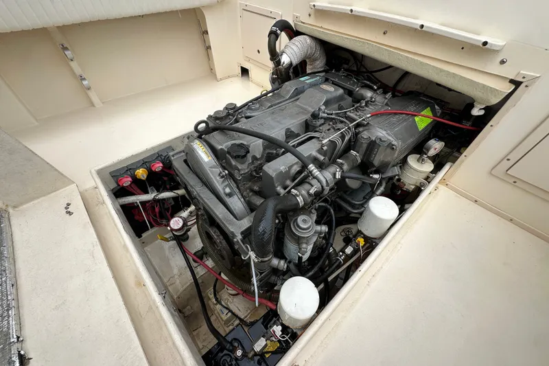Slide: The Image of Engine compartment of a 2003 Parker 2520 Deep Vee Sport Cabin boat. - 25