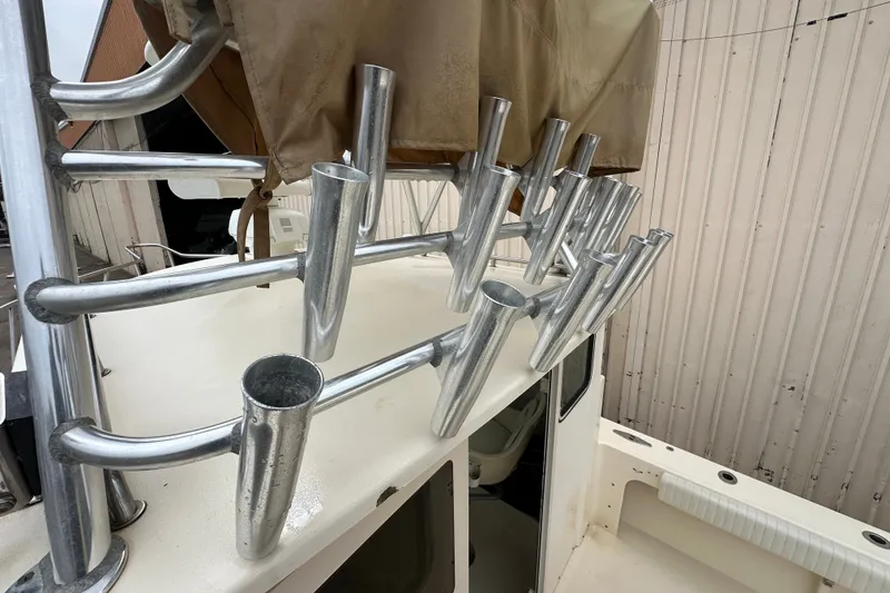 Slide: The Image of Rod holders on a 2003 Parker 2520 Deep Vee Sport Cabin boat. - 19