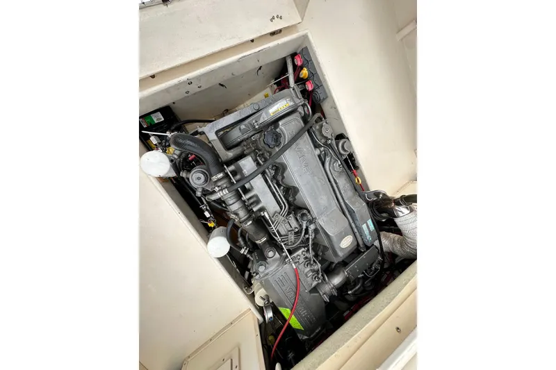 Slide: The Image of Engine compartment of a 2003 Parker 2520 Deep Vee Sport Cabin boat. - 24