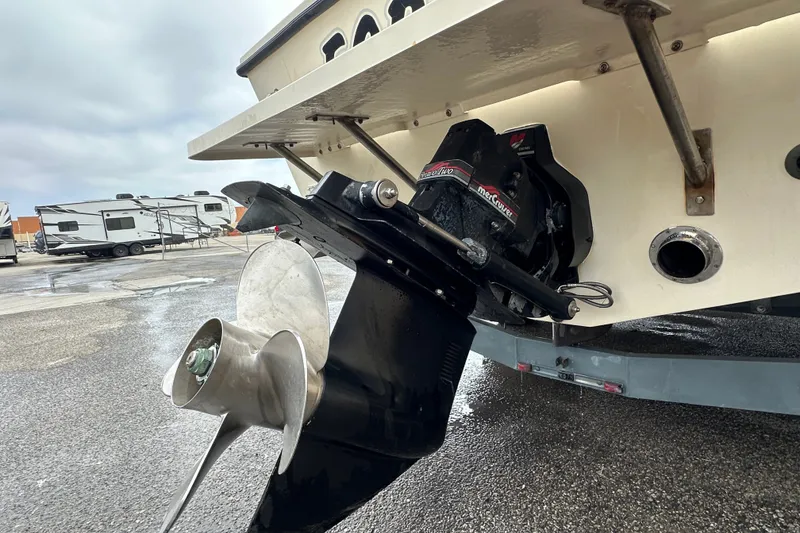 Slide: The Image of Close-up of a 2003 Parker 2520 Deep Vee Sport Cabin boat's propeller and outdrive. - 28